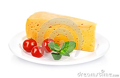 Yellow cheese in plate with tomatoes and leaf Stock Photo