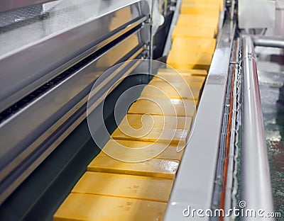 Yellow cheese production line for cheese factory Stock Photo