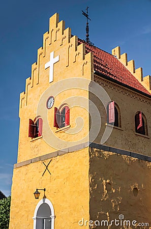 The yellow Church of Allinge on Bornholm Stock Photo