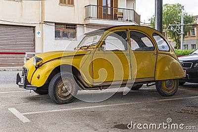 Yellow Citroen 2 CV car parked on the street Editorial Stock Photo