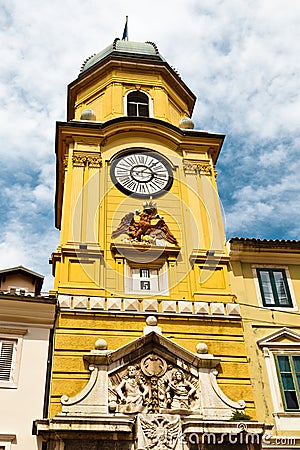 Yellow Clock Tower with Relief in Rijeka Stock Photo