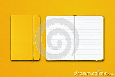 Yellow closed and open lined notebooks isolated on colorful background Stock Photo