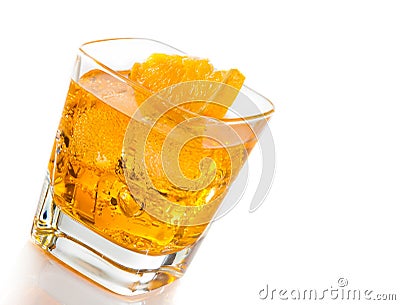 Yellow cocktail tilted with orange slice isolated on white background Stock Photo