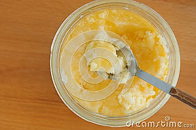 Yellow coconut oil in a jar Stock Photo