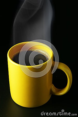 Yellow coffee cup with steam Stock Photo