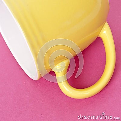 Yellow Coffee Cup on a Vibrant Background Stock Photo