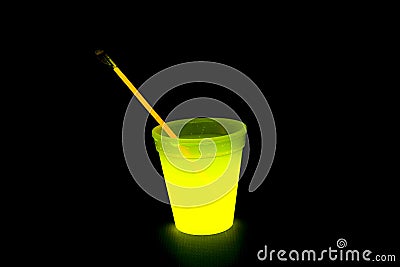 Yellow colored fluorescent glass with glow sticks lights Stock Photo