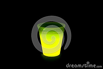 Yellow colored fluorescent glass with glow sticks lights Stock Photo