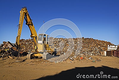 Yellow Crane & Scrap Yard Stock Photo