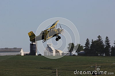 Yellow crop dusting biplane Editorial Stock Photo