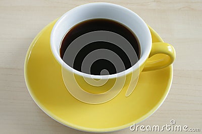 Yellow cup of coffee Stock Photo