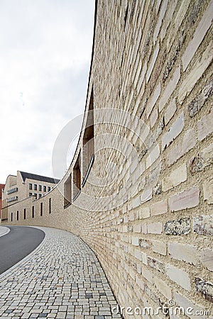 Yellow curved wall in Rottenburg Stock Photo