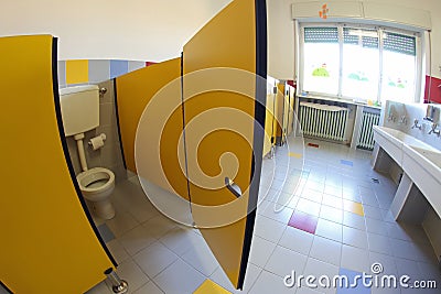 Yellow door into bathrooms with sinks of a nursery Stock Photo