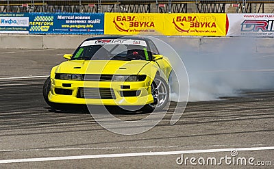 Yellow drift car brand Nissan overcome turn track Editorial Stock Photo