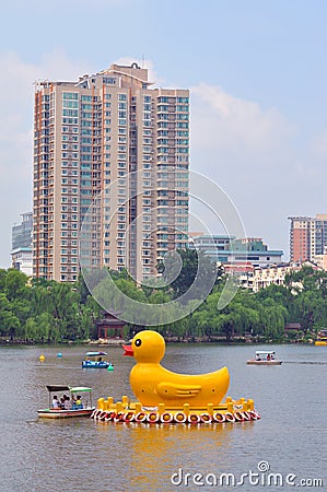 Yellow Ducks in Black Bamboo Park in Beijing Editorial Stock Photo