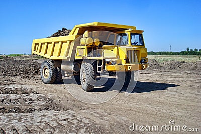 Yellow dump truck Stock Photo