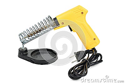 Yellow electrical solder on soldering iron stand. Stock Photo