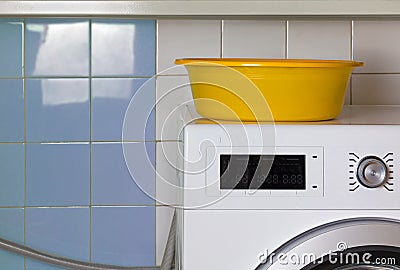 Yellow Empty Wash Bowl in the Laundry Room Stock Photo