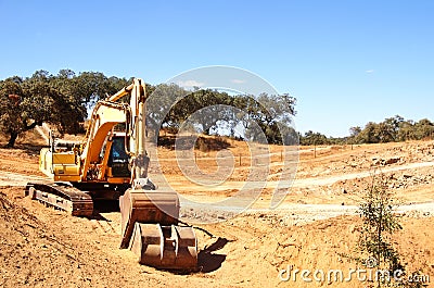 yellow excavator machine preparing soil Stock Photo