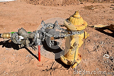 A system of valves are attached to a water fire hydrant Stock Photo