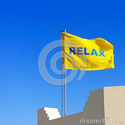 Yellow flag with a word Relax Stock Photo