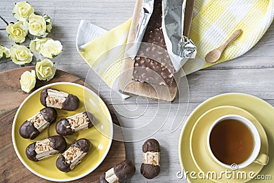 Typical cookies from The Netherlands, with chocolate and almonds, called Bokkepootje and cup of tea Stock Photo
