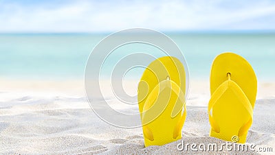 Yellow flip flops on beach sand texture and tropical sea background. Summer holidays and hot season. Fun ocean weekend. Summertime Stock Photo