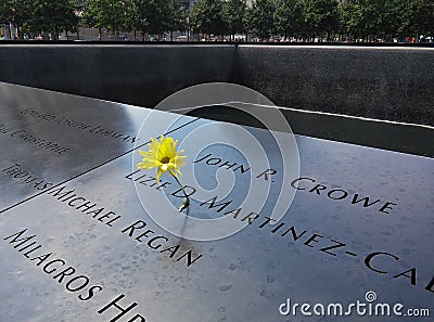 Yellow flower on World Trade Center Memorial pool. August 2015 Editorial Stock Photo