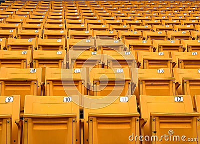 Yellow folding chairs lined on the stadium sport Stock Photo