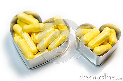 Yellow food supplemnet CoQ10 (Co-enzyme Q10) capsules Stock Photo