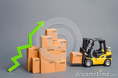 Yellow Forklift truck brings the box to a stack of boxes and a green arrow up. raise economic indicators. exports, imports. sales Stock Photo