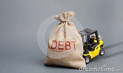 Yellow forklift truck can not lift the bag with the inscription debt. Inability to repay a loan, debt restructuring. High business Stock Photo