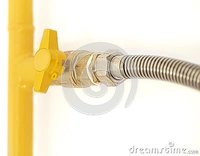 Yellow gas pipe with a valve. White background Stock Photo