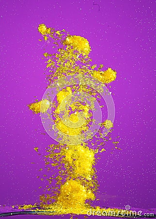 Yellow glass shards and water Stock Photo