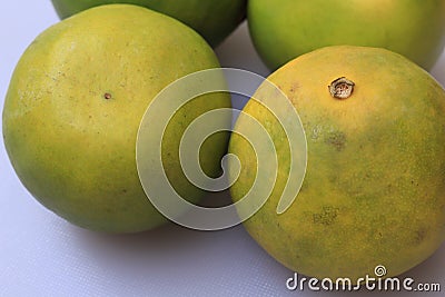 Yellow and green color whole ripe Sweet lime fruits or Citrus limett Stock Photo