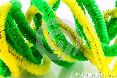 Yellow and green pipe cleaners Stock Photo