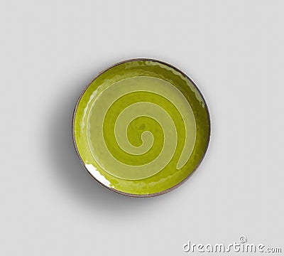 Yellow Green Swirl Melamine Plate with light gray background Stock Photo