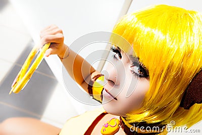 Yellow hair. Cosplay girl, costume cartoon Japanese manga. Stock Photo