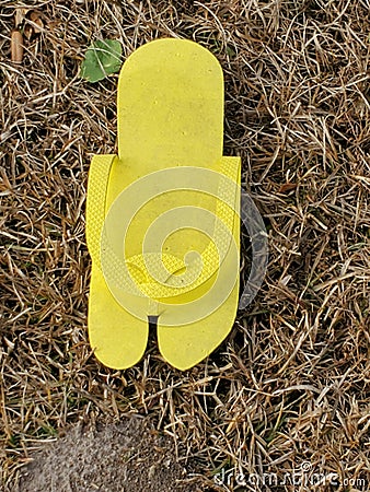 Yellow hand made flip-flop diwhy Stock Photo