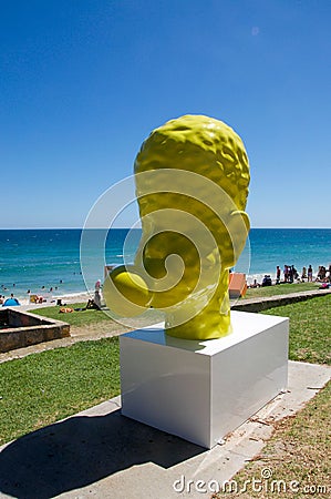 Yellow Head Sculpture: Blowing Bubble Editorial Stock Photo