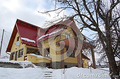 The yellow house in to the mountains Stock Photo