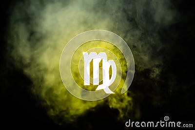 Yellow illuminated Virgo zodiac sign with smoke Stock Photo