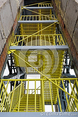 Yellow industrial stairs. Metal, production, mechanical engineering, technologies Stock Photo