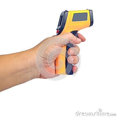 Yellow Infrared thermometer gun in hand used to measure temperature on white Stock Photo