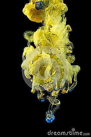 Yellow ink color drop underwater Stock Photo