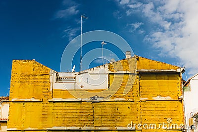 Yellow insulating material on building in Granada, Spain Stock Photo