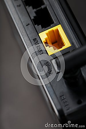 Yellow Internet connector for connection to the network, Wi-Fi router for Internet access Stock Photo