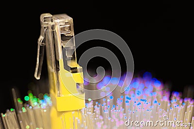 Yellow internet switch close up macro shot , blue , green optical fibres. Stock Photo