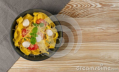 Yellow italian pasta pappardelle, fettuccine or tagliatelle Stock Photo