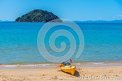 Yellow kayaks at Onetahuti beach at Abel Tasman national park in New Zealand Stock Photo